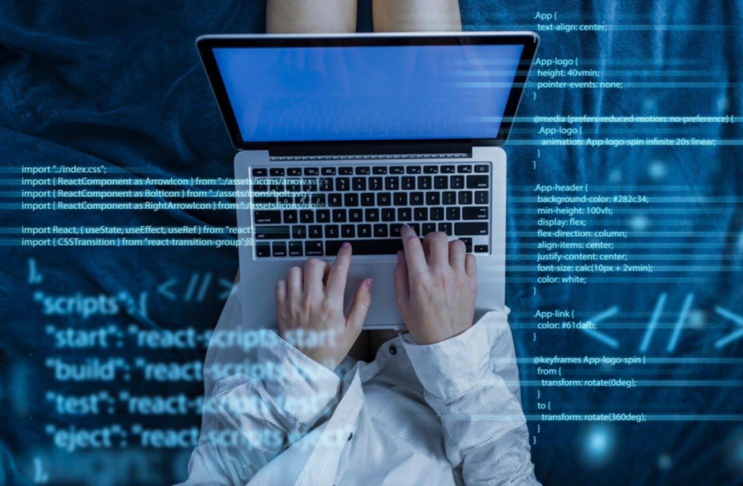 Student working on responsive web design project on multiple devices